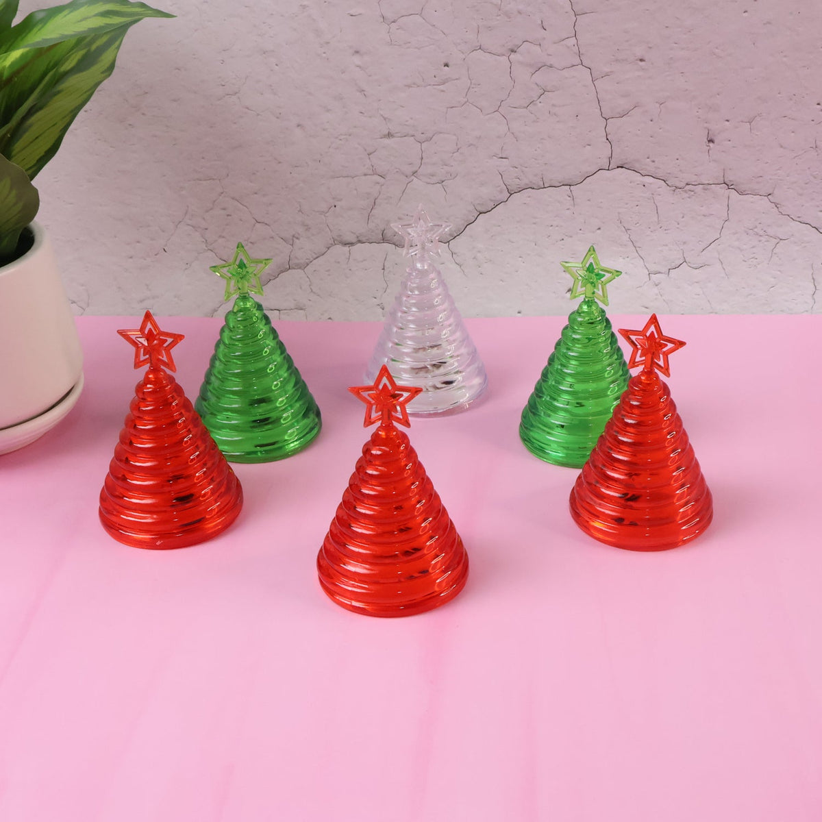 Set of mini LED Christmas tree lights glowing red, green, and white indoors